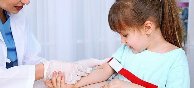 Taking blood for analysis of worms in a child